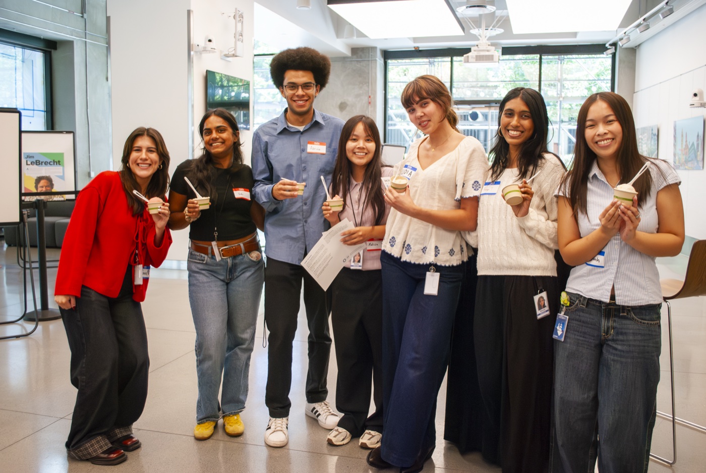 Group of summer interns holding cups of gelato at an MTC event